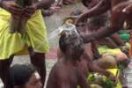 தலையில் தேங்காய் உடைத்து பக்தர்கள் நேர்த்திக்கடன்!