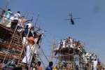காமாட்சியம்மன் கும்பாபிஷேகம்: ஹெலிகாப்டர் மூலம் கங்கை புனித நீர் தெளிப்பு