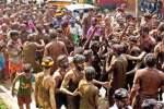 தாண்டிக்குடியில் பக்தர்கள் சேறு பூசும் திருவிழா
